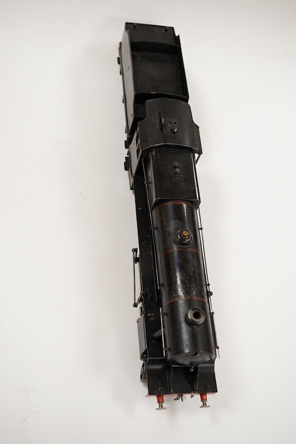 An 0 gauge Bassett-Lowke live steam spirit fired tinplate BR 2-6-0 Mogul tender locomotive, 42980, with original fuel tank and burner, two controls in the cab accessed through the cab roof